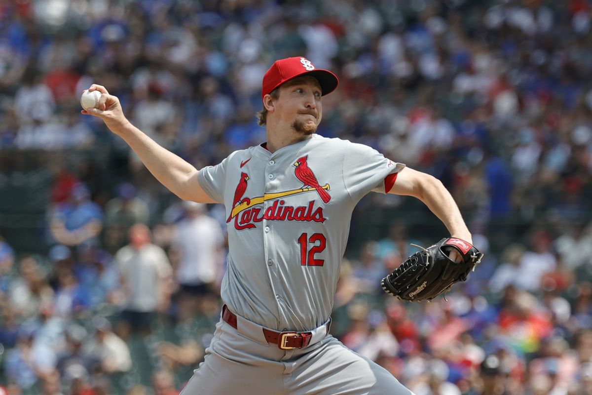 Aug 2, 2024; Chicago, Illinois, USA; St. Louis Cardinals starting pitcher Erick Fedde (12) delivers against the Chicago Cubs during the first inning at Wrigley Field. Mandatory Credit: Kamil Krzaczynski-USA TODAY Sports