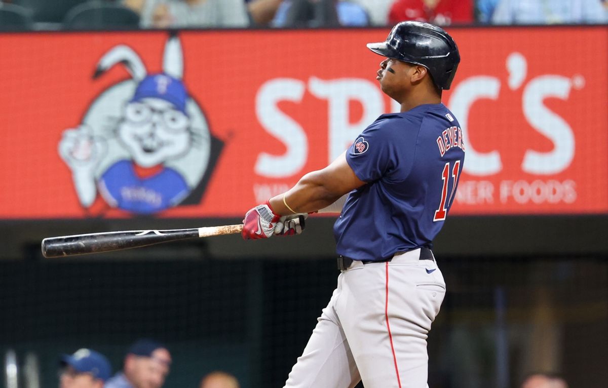 Aug 2, 2024; Arlington, Texas, USA; Boston Red Sox third baseman Rafael Devers (11) hits a home run during the ninth inning against the Texas Rangers at Globe Life Field. Mandatory Credit: Kevin Jairaj-USA TODAY Sports