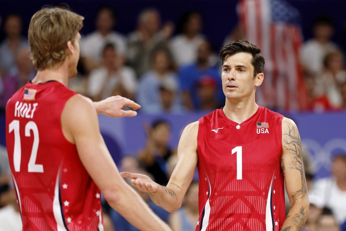 Aug 2, 2024; Paris, France; United States middle blocker Maxwell Holt (12) high fives opposite Matthew Anderson (1) after a play against Japan during a menís volleyball pool C match during the Paris 2024 Olympic Summer Games at South Paris Arena 1. Mandatory Credit: Yukihito Taguchi-USA TODAY Sports