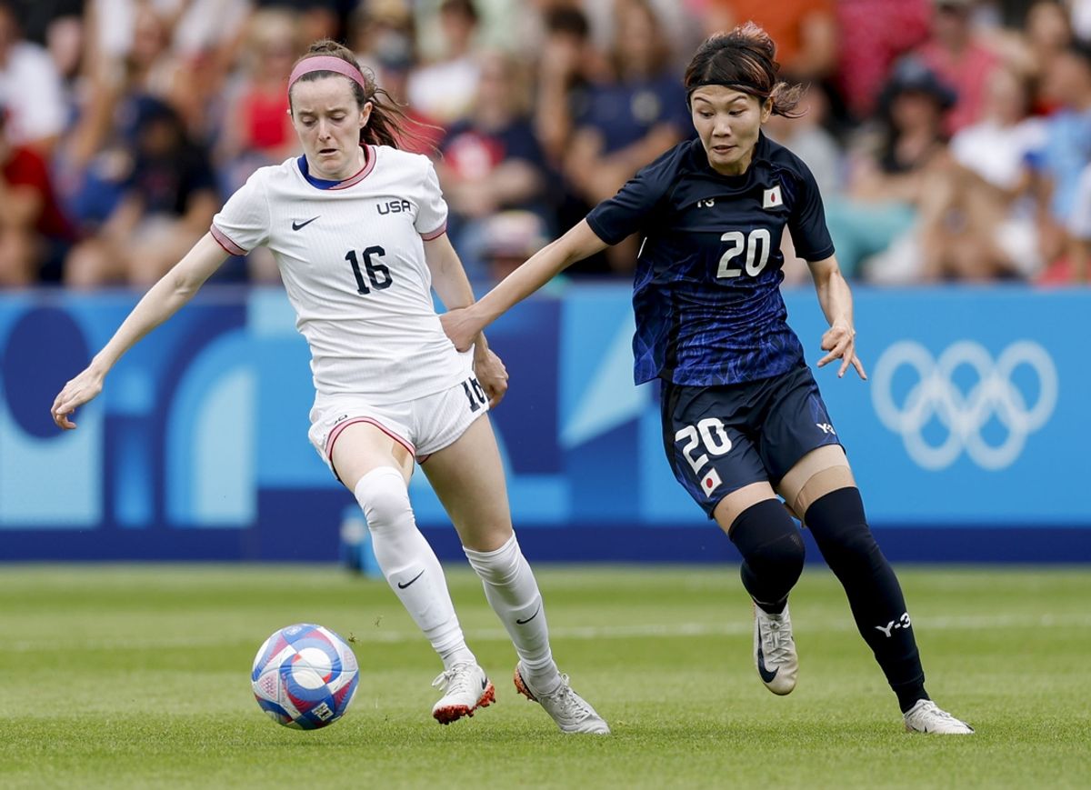 Aug 3, 2024; Paris, France; United States midfielder Rose Lavelle (16) and Japan defender Miyabi Moriya (20) during the Paris 2024 Olympic Summer Games at Parc des Princes. Mandatory Credit: Yukihito Taguchi-Imagn Images