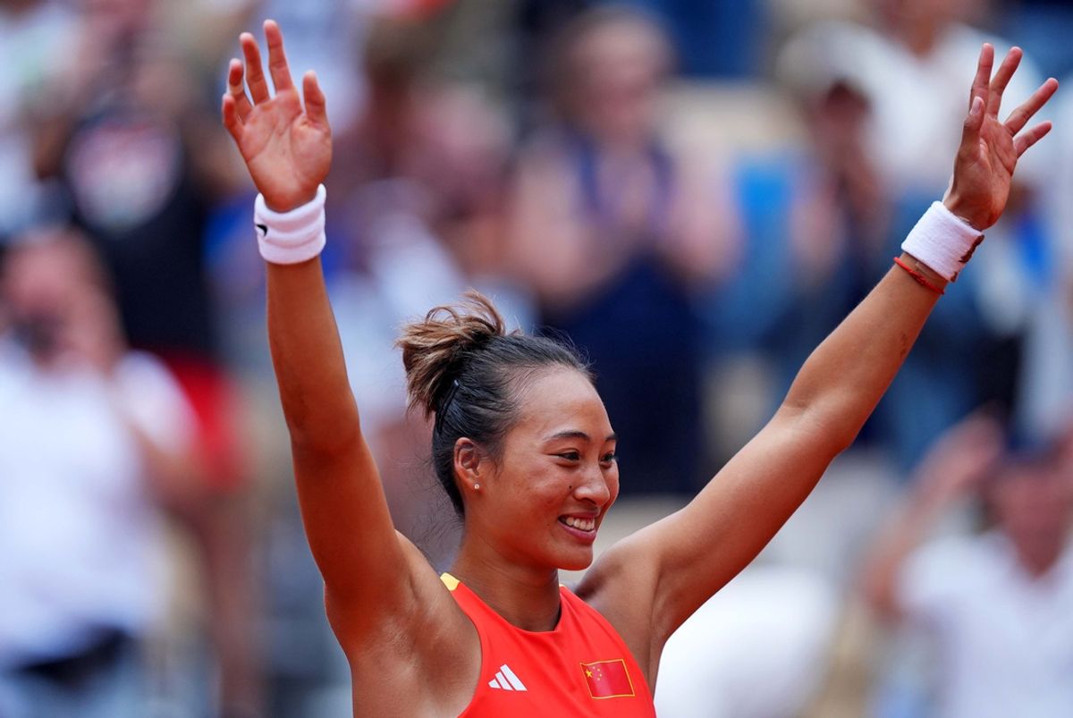 Aug 3, 2024; Paris, France; Qinwen Zheng (CHN) celebrates after defeating Donna Vekic (CRO) in the women’s tennis gold medal match medal match during the Paris 2024 Olympic Summer Games at Stade Roland Garros. Mandatory Credit: Amber Searls-Imagn Images