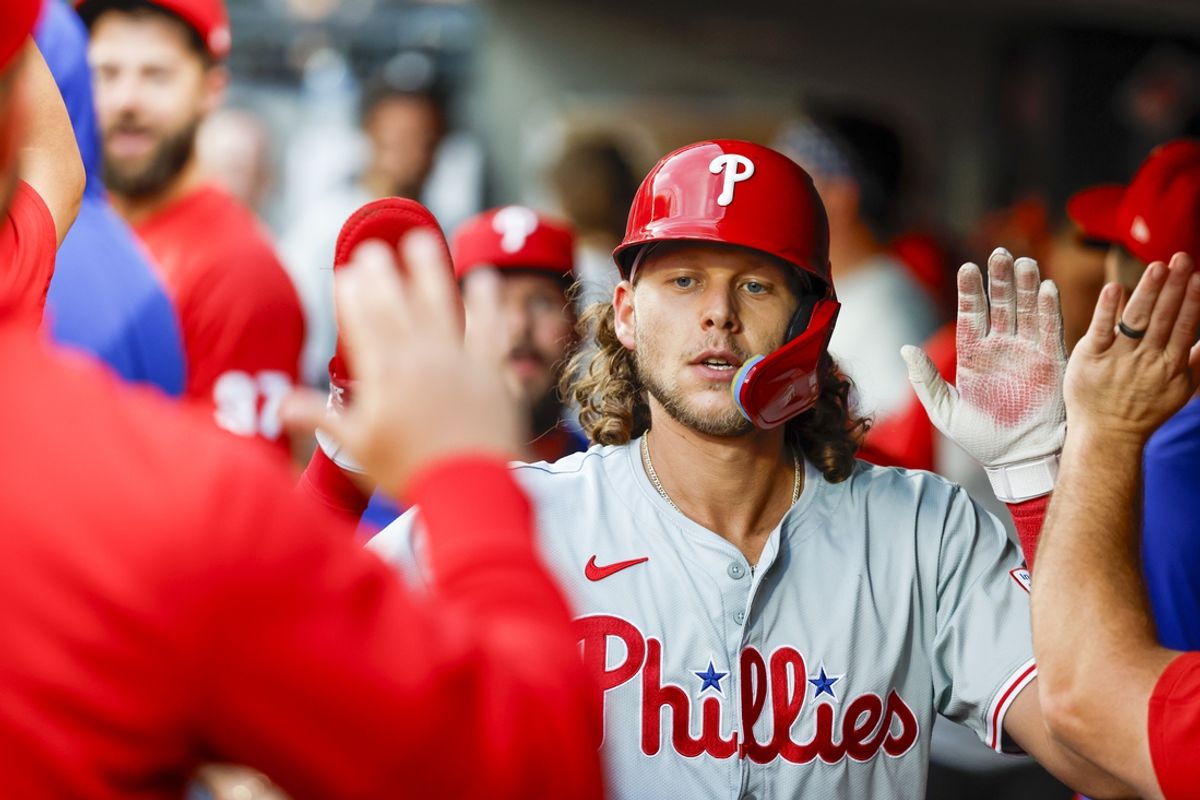 Aug 3, 2024; Seattle, Washington, USA; Philadelphia Phillies third baseman Alec Bohm (28) high-fives teammates in the dugout after scoring a run against the Seattle Mariners during the fifth inning at T-Mobile Park. Mandatory Credit: Joe Nicholson-USA TODAY Sports