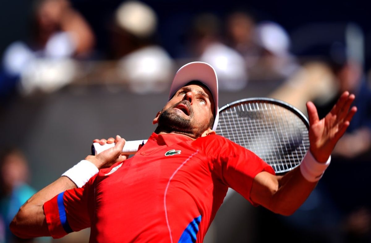 Aug 4, 2024; Paris, France; Novak Djokovic (SRB) serves in the men’s singles gold medal match against Carlos Alcaraz  (not pictured) during the Paris 2024 Olympic Summer Games at Stade Roland Garros. Mandatory Credit: Amber Searls-Imagn Images