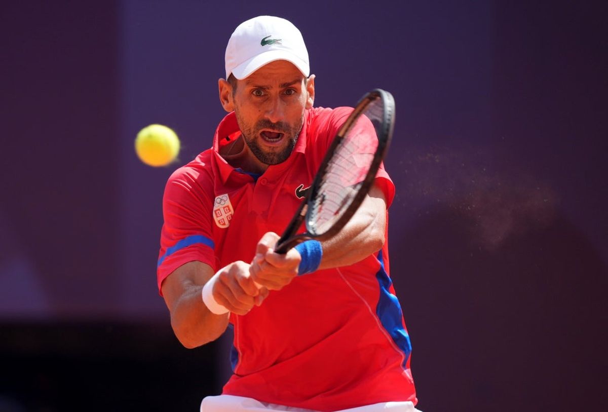 Aug 4, 2024; Paris, France; Novak Djokovic (SRB) returns a shot in the men’s singles gold medal match against Carlos Alcaraz (not pictured) during the Paris 2024 Olympic Summer Games at Stade Roland Garros. Mandatory Credit: Amber Searls-Imagn Images