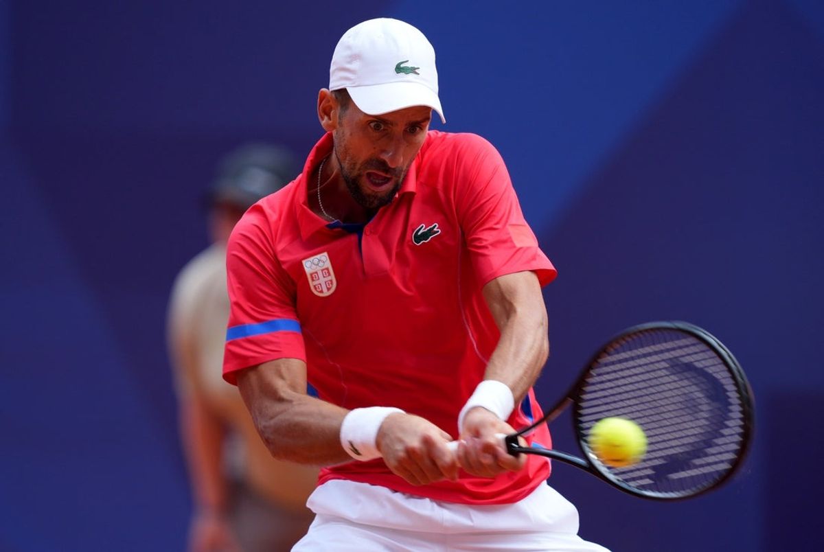 Aug 4, 2024; Paris, France; Novak Djokovic (SRB) returns a shot in the men’s singles gold medal match against Carlos Alcaraz (not pictured) during the Paris 2024 Olympic Summer Games at Stade Roland Garros. Mandatory Credit: Amber Searls-Imagn Images