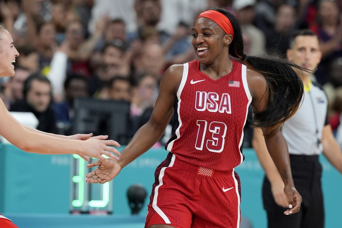 Aug 4, 2024; Villeneuve-d'Ascq, France; United States guard Jackie Young (13) celebrates in the second half against Germany in a women’s group C game during the Paris 2024 Olympic Summer Games at Stade Pierre-Mauroy. Mandatory Credit: John David Mercer-USA TODAY Sports