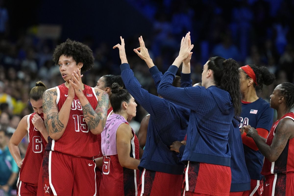 Aug 4, 2024; Villeneuve-d'Ascq, France; United States centre Brittney Griner (15) celebrates with teammates after defeating Germany in a women’s group C game during the Paris 2024 Olympic Summer Games at Stade Pierre-Mauroy. Mandatory Credit: John David Mercer-USA TODAY Sports