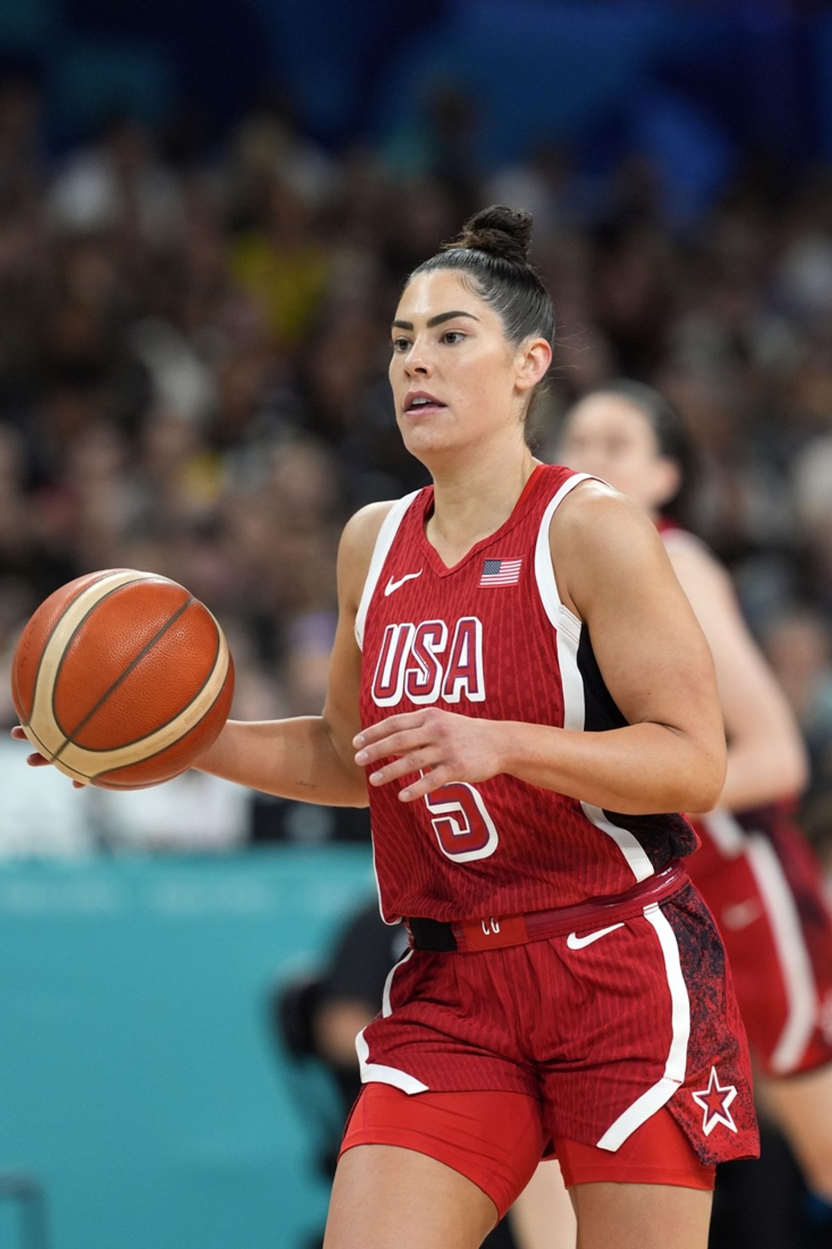 Aug 4, 2024; Villeneuve-d'Ascq, France; United States guard Kelsey Plum (5) controls the ball in the second half against Germany in a women’s group C game during the Paris 2024 Olympic Summer Games at Stade Pierre-Mauroy. Mandatory Credit: John David Mercer-USA TODAY Sports