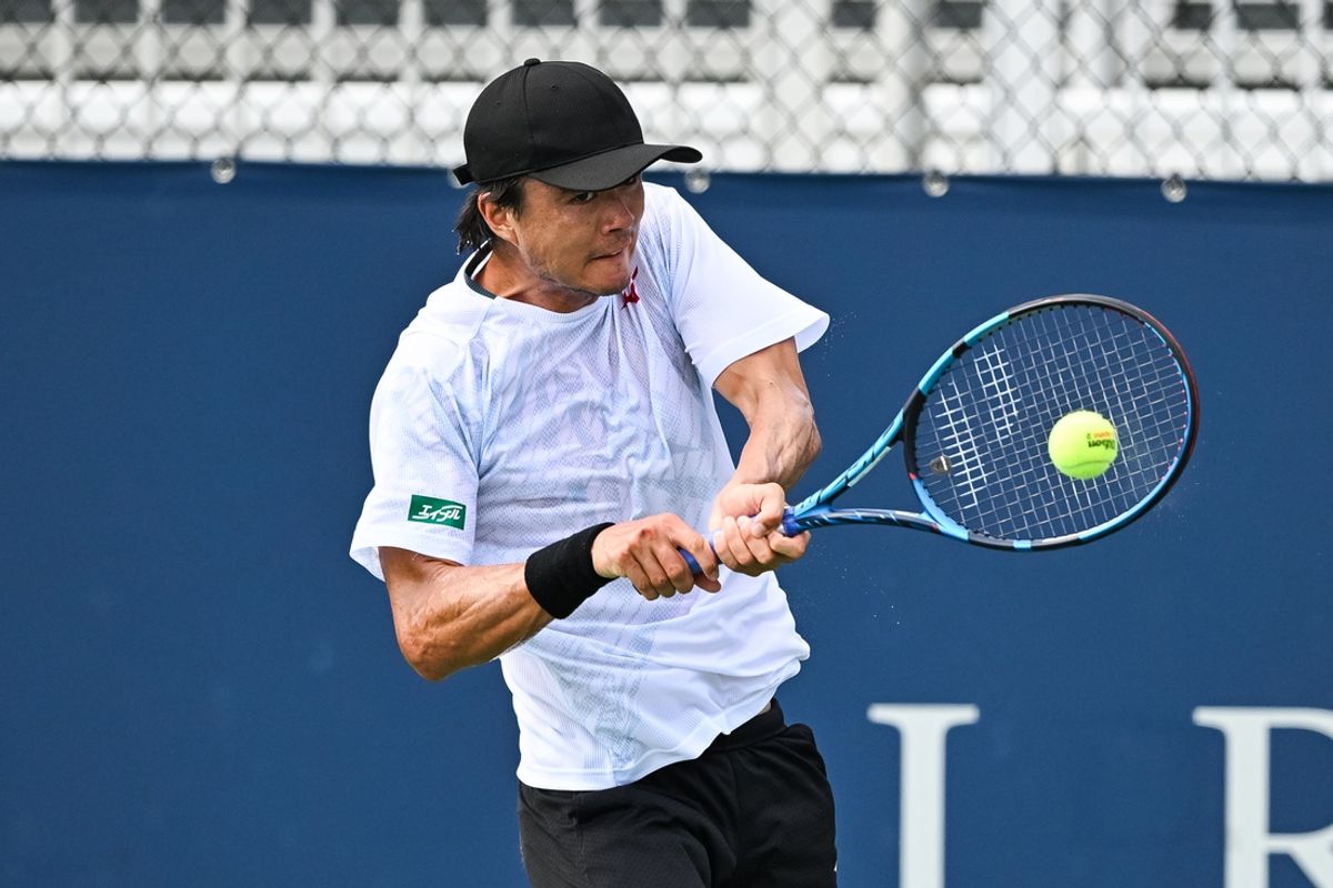 Aug 4, 2024; Montreal, Quebec, Canada; Taro Daniel (JPN) returns the ball against Aleksandar Kovacevic (USA) (not pictured) in first round qualifying play at IGA Stadium. Mandatory Credit: David Kirouac-Imagn Images
