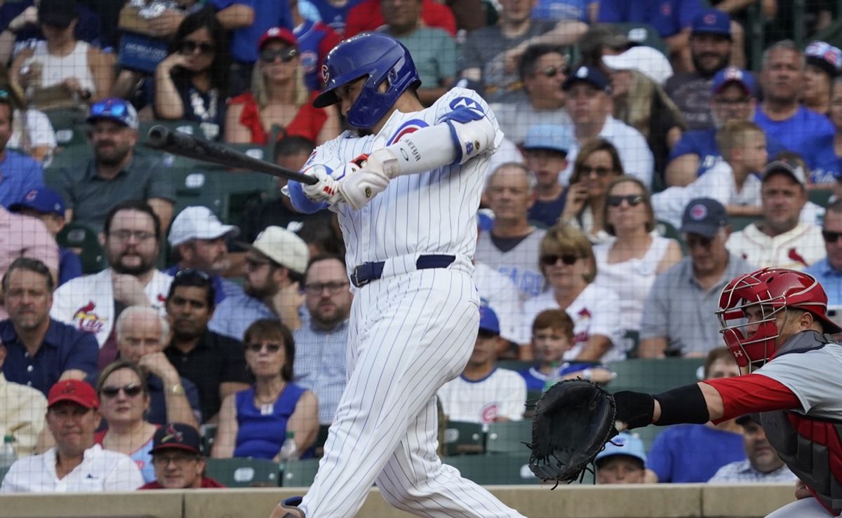 Aug 4, 2024; Chicago, Illinois, USA; Chicago Cubs outfielder Seiya Suzuki (27) hits a single against the St. Louis Cardinals during the first inning at Wrigley Field. Mandatory Credit: David Banks-USA TODAY Sports