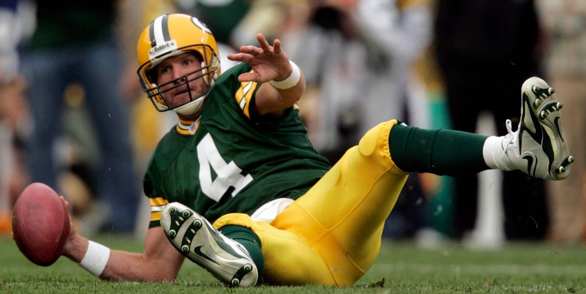 Green Bay Packers quarterback Brett Favre looks to throw the ball after tripping during the first quarter of their game against the Chicago Bears Sunday, September 10, 2006 at Lambeau Field in Green Bay, Wis. Favre did not throw the ball and took a seven yard loss on the play.