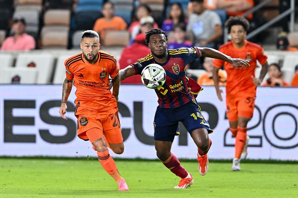Aug 5, 2024; Houston, Texas, USA; Houston Dynamo FC midfielder Sebastian Kowalczyk (27) and Real Salt Lake midfielder Emeka Eneli (14) in action during the second half at Shell Enegry Stadium. Mandatory Credit: Maria Lysaker-USA TODAY Sports