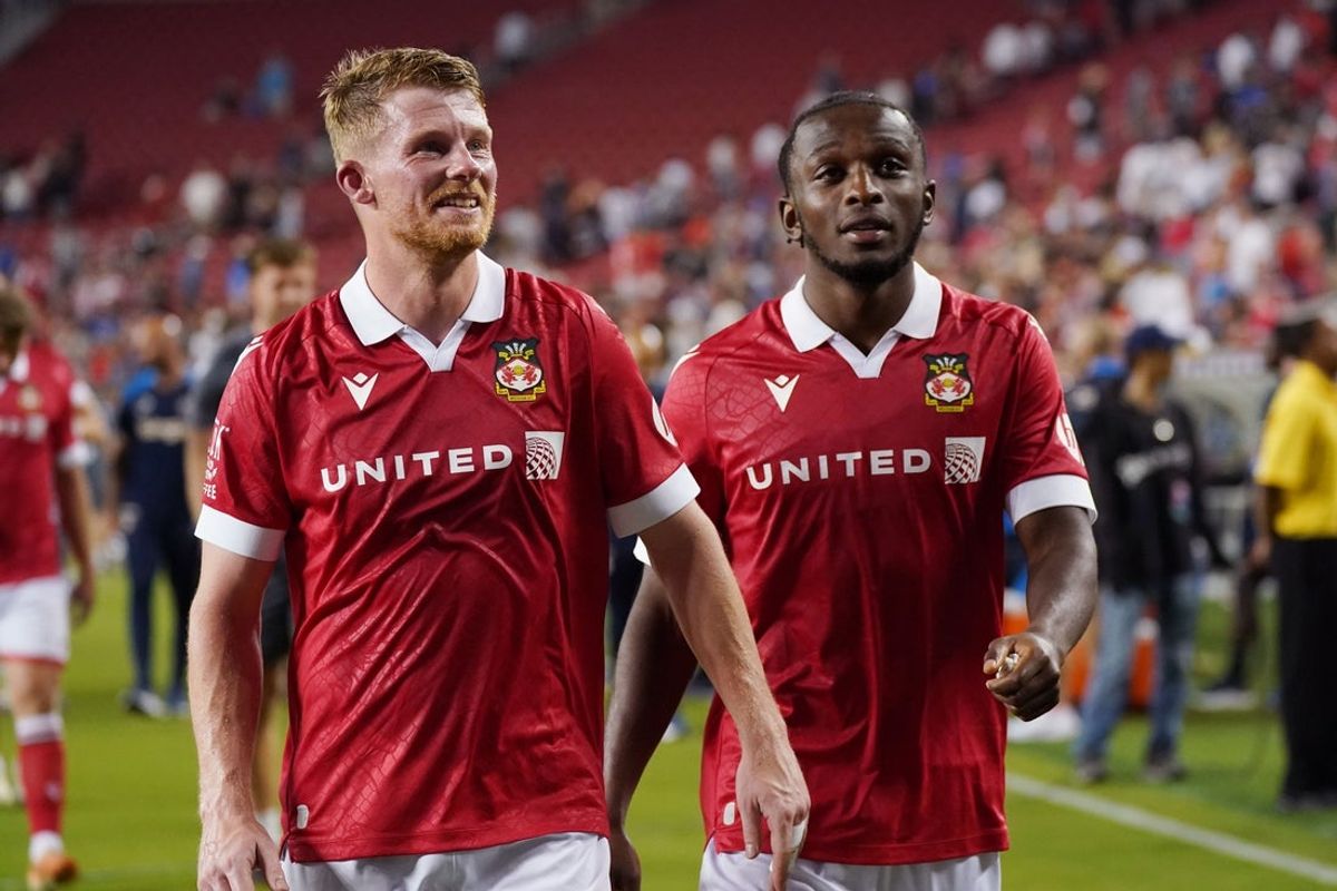 Wrexham's Andy Cannon and fellow midfielder Sebastian Revan (53) walk off the field after the match against Chelsea at Levi's Stadium. Credit: David Gonzales-Imagn Images
