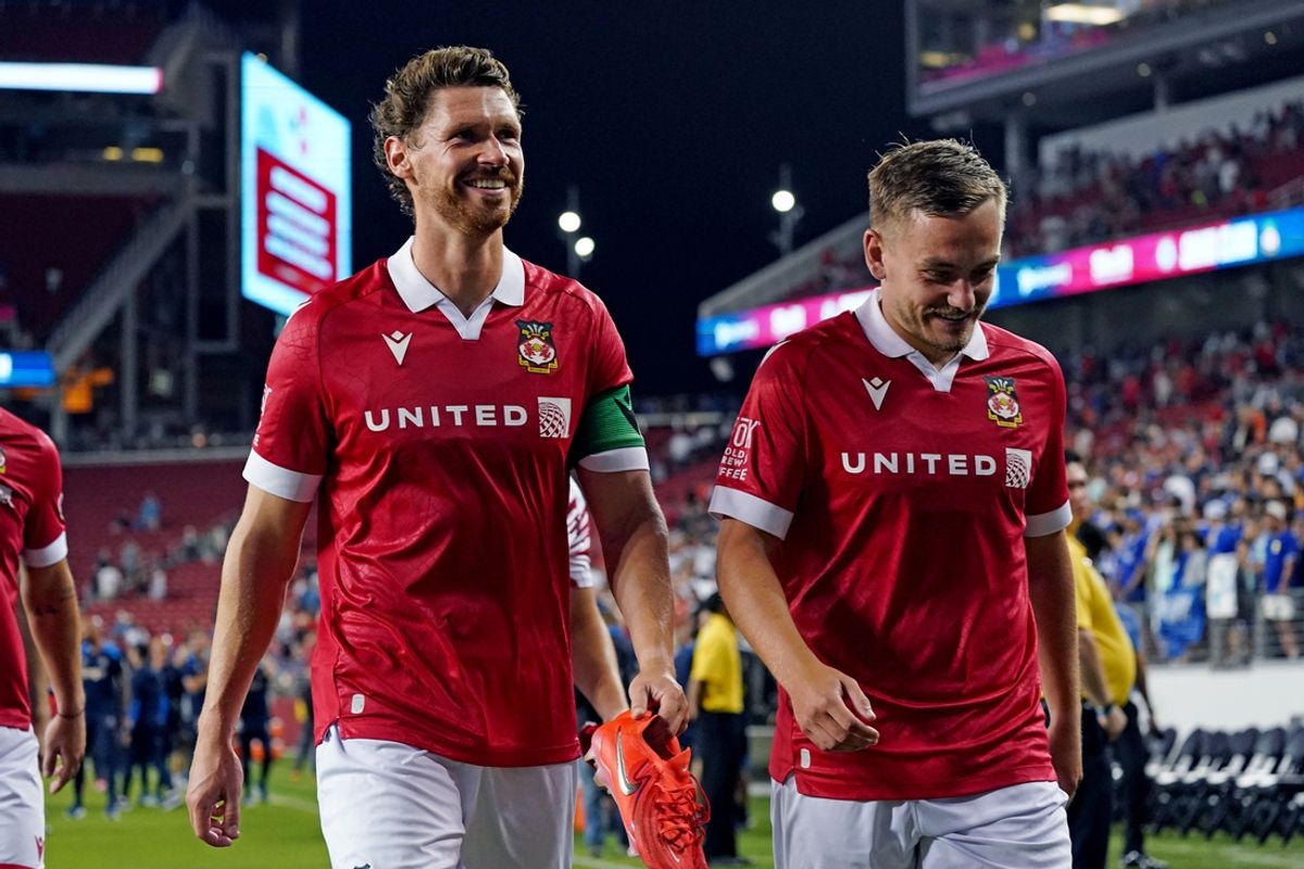 Jul 24, 2024; Santa Clara, CA, USA; Wrexham midfielder George Evans (12) and Wrexham midfielder Luke Bolton (17) walk off the field after the match against Chelsea at Levi's Stadium. Mandatory Credit: David Gonzales-Imagn Images