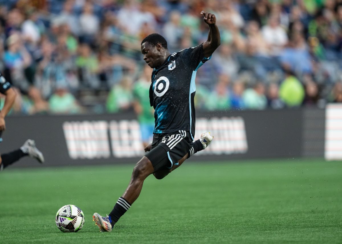 Jul 26, 2024; Seattle, Washington, USA;  Minnesota United forward Bongokuhle Hlongwane (21) takes a shot against against Seattle Sounders FC at Lumen Field. Mandatory Credit: Stephen Brashear-Imagn Images