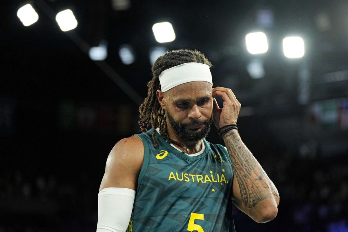 Aug 6, 2024; Paris, France; Australia guard Patty Mills (5) reacts after losing to Serbia in men’s basketball quarterfinals during the Paris 2024 Olympic Summer Games at Accor Arena. Mandatory Credit: Kyle Terada-USA TODAY Sports