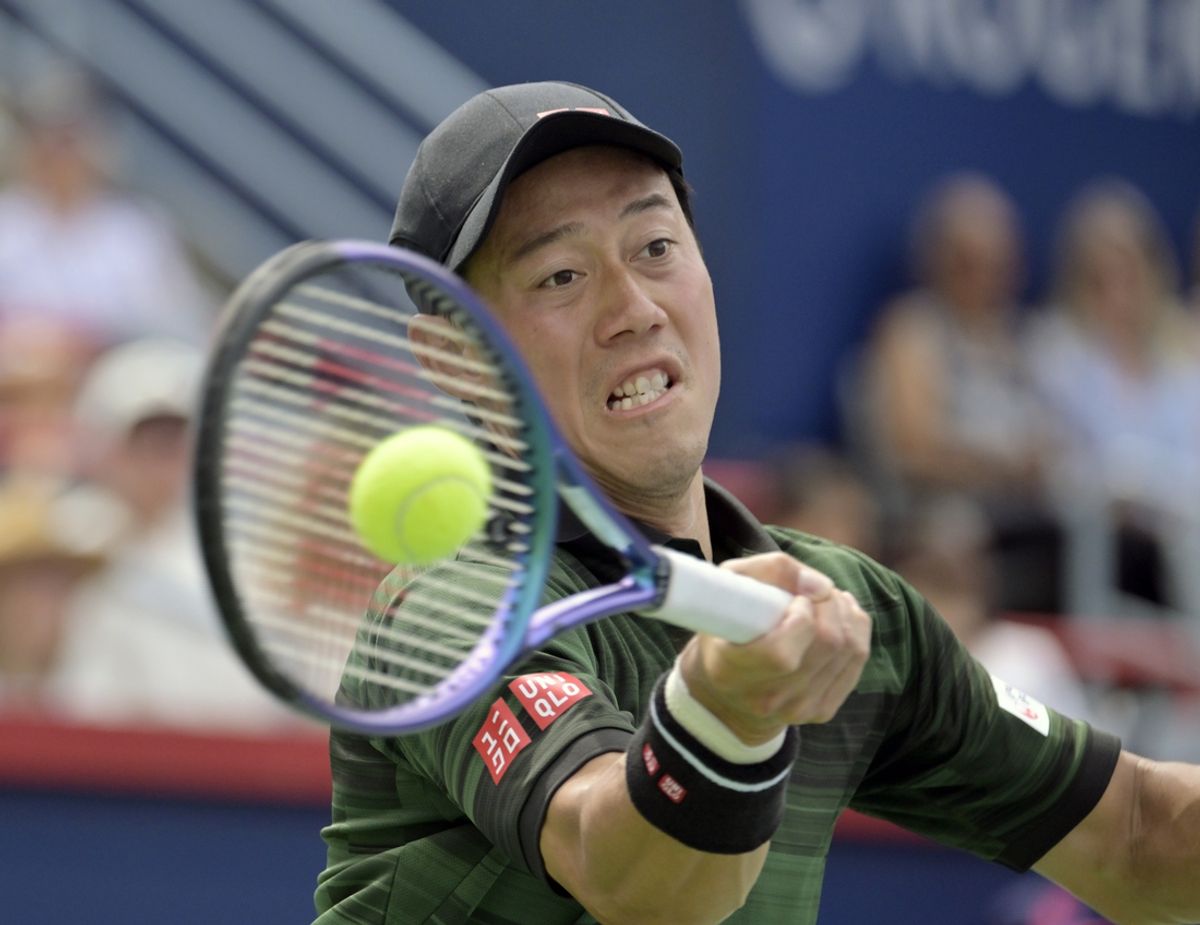 Aug 6, 2024; Montreal, Quebec, Canada; Kei Nishikori (JPN) hits a forehand against Alex Michelsen (USA) (not pictured) in first round play at IGA Stadium. Mandatory Credit: Eric Bolte-USA TODAY Sports