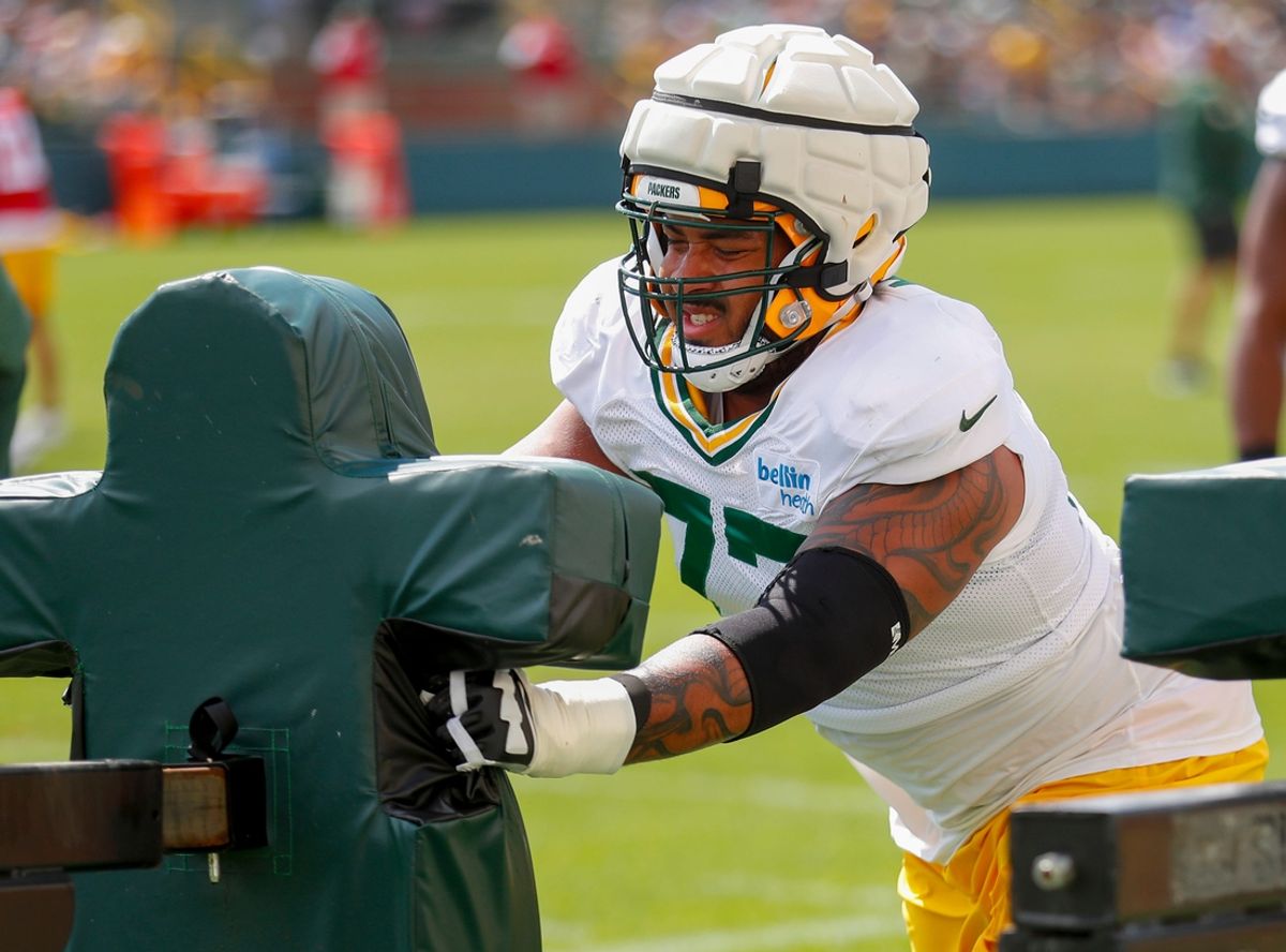 Green Bay Packers offensive lineman Jordan Morgan (77) runs through a drill during the 11th practice of training camp on Tuesday, August 6, 2024, at Ray Nitschke Field in Ashwaubenon, Wis. 
Tork Mason/USA TODAY NETWORK-Wisconsin