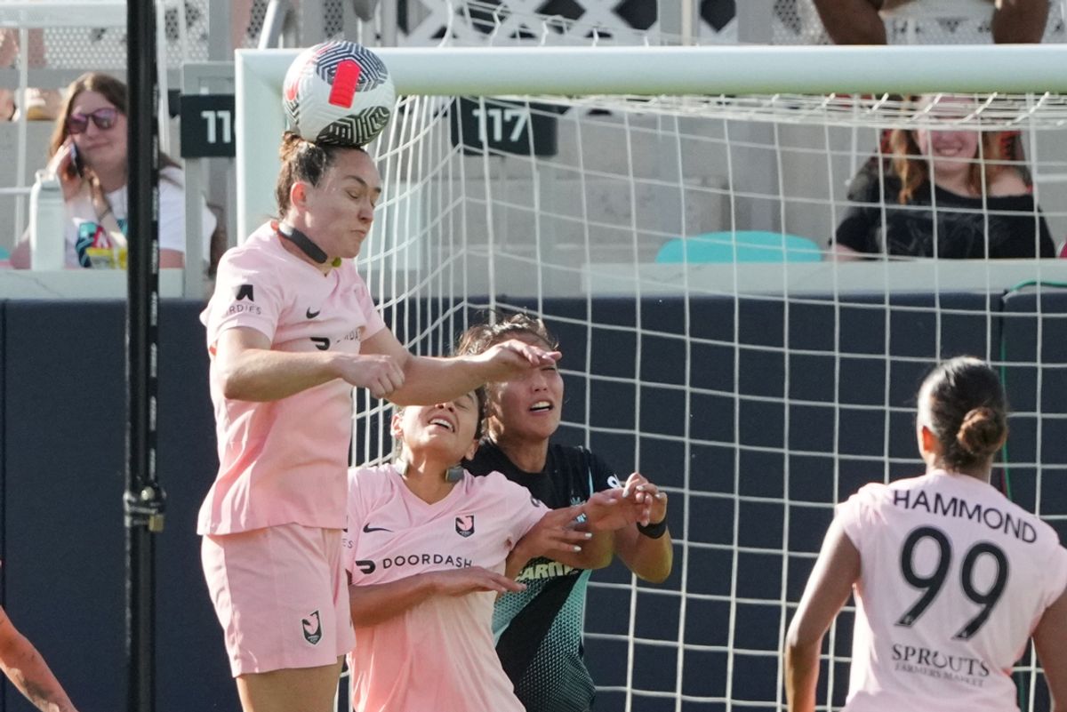 Aug 6, 2024; Kansas City, MO, USA; Angel City FC defender Megan Reid (6) heads the ball in the second half against NJ/NY Gotham FC at CPKC Stadium. Mandatory Credit: Denny Medley-USA TODAY Sports