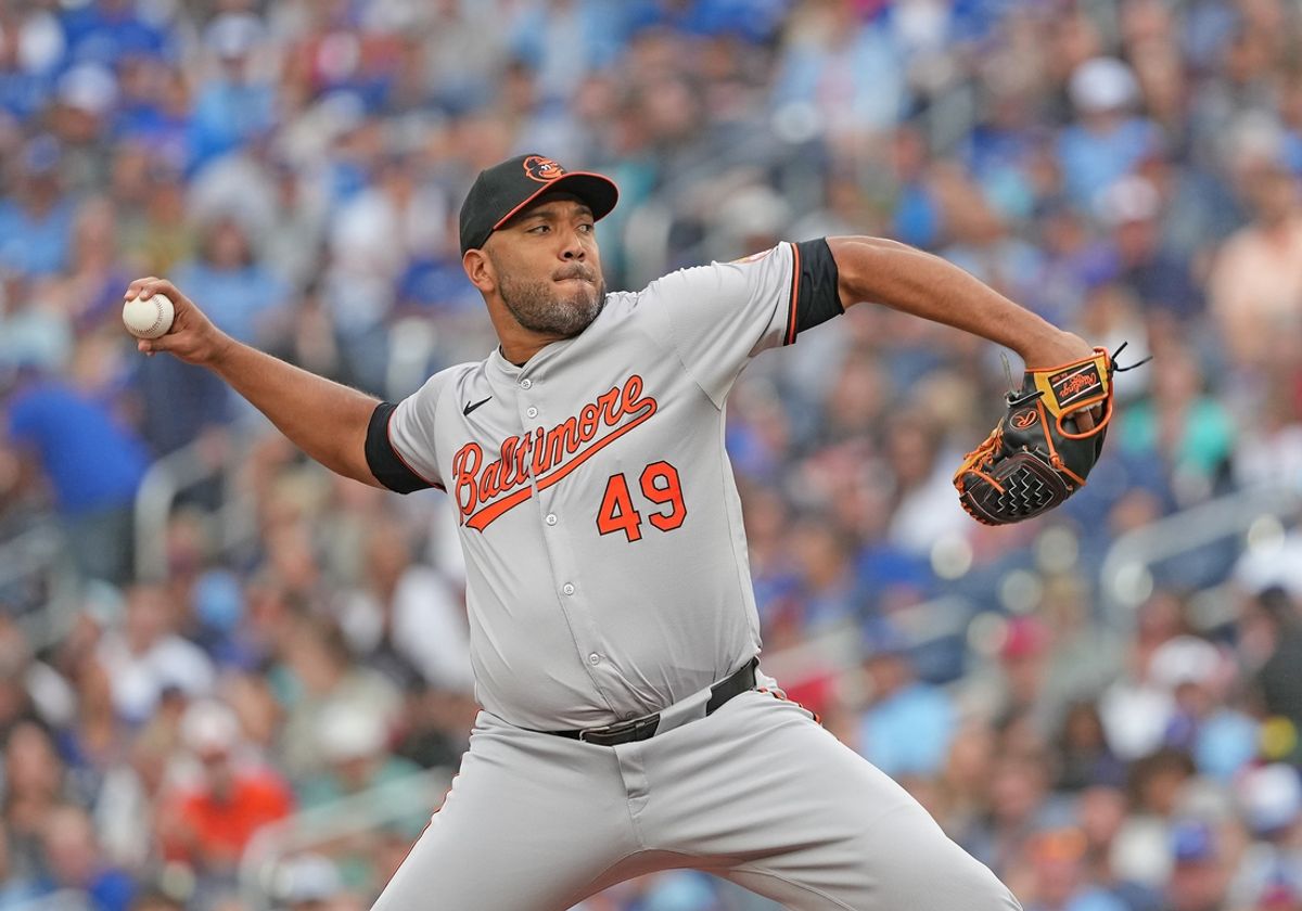 Aug 6, 2024; Toronto, Ontario, CAN; Baltimore Orioles starting pitcher Albert Suarez (49) throws a pitch against the Toronto Blue Jays during the first inning at Rogers Centre. Mandatory Credit: Nick Turchiaro-USA TODAY Sports