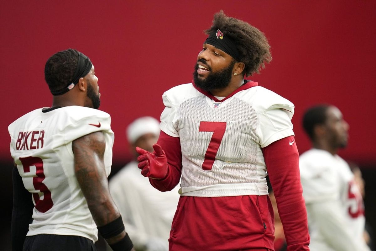 Arizona Cardinals Kyzir White (7) chats with teammate Budda Baker (3) during training camp at State Farm Stadium on Aug 6, 2024, in Glendale, Ariz.