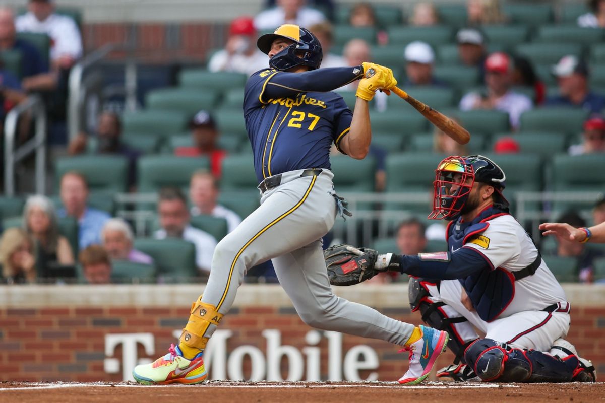Aug 6, 2024; Atlanta, Georgia, USA; Milwaukee Brewers shortstop Willy Adames (27) hits a two-run home run against the Atlanta Braves in the first inning at Truist Park. Mandatory Credit: Brett Davis-USA TODAY Sports