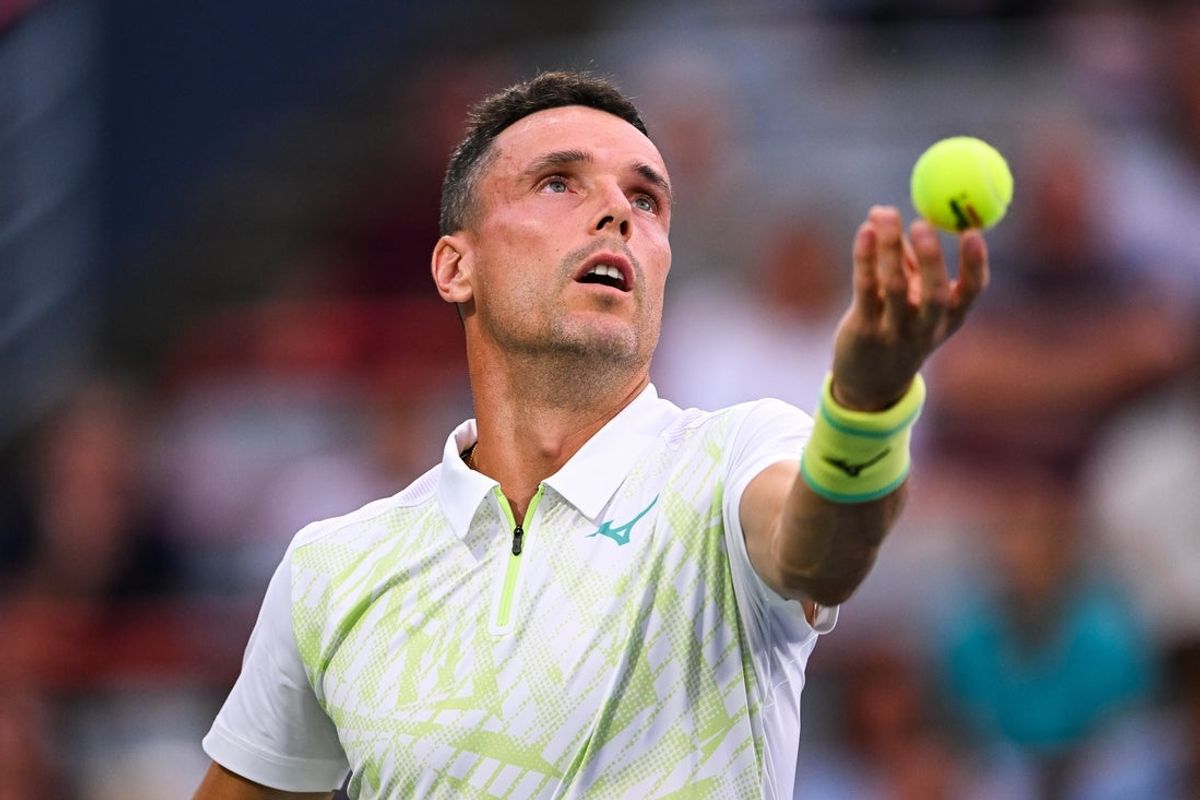 Aug 6, 2024; Montreal, Quebec, Canada; Roberto Bautista Agut (ESP) serves the ball to Holger Rune (DEN) (not pictured) in first round play at IGA Stadium. Mandatory Credit: David Kirouac-Imagn Images