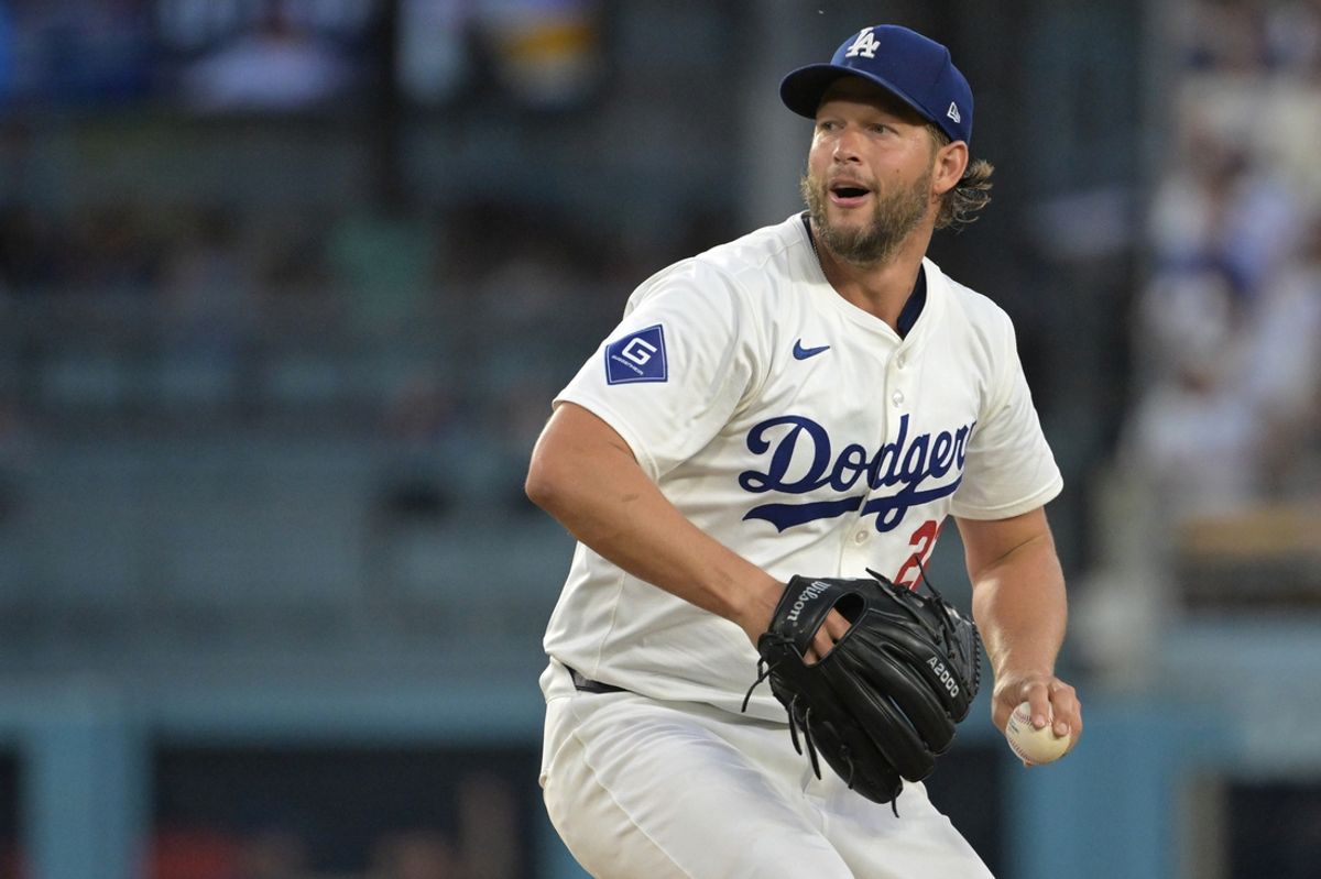 Aug 6, 2024; Los Angeles, California, USA;  Los Angeles Dodgers starting pitcher Clayton Kershaw (22) delivers to the plate in the third inning against the Philadelphia Phillies at Dodger Stadium. Mandatory Credit: Jayne Kamin-Oncea-USA TODAY Sports