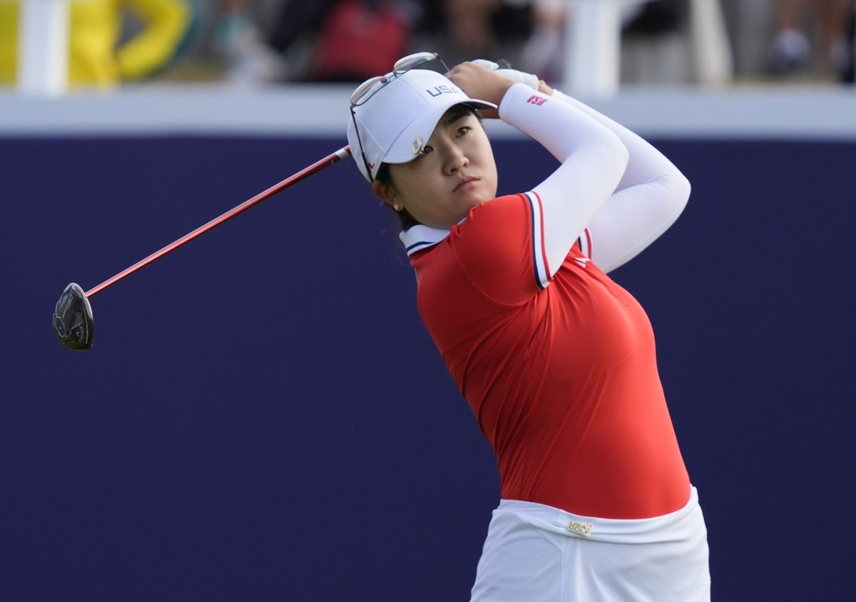 Aug 7, 2024; Saint-Quentin-en-Yvelines, France;  Rose Zhang (USA) hits her tee shot on the 1st hole in the first round of women's individual stroke play during the Paris 2024 Olympic Summer Games at Le Golf National. Mandatory Credit: Katie Goodale-USA TODAY Sports