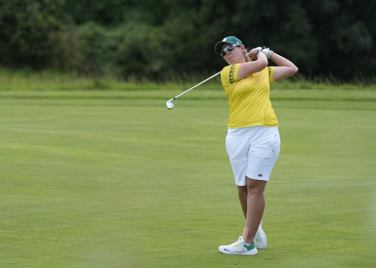 Aug 7, 2024; Saint-Quentin-en-Yvelines, France;  Ashleigh Buhai (RSA) hits from the fairway on the 7th hole in the first round of women's individual stroke play during the Paris 2024 Olympic Summer Games at Le Golf National. Mandatory Credit: Katie Goodale-Imagn Images