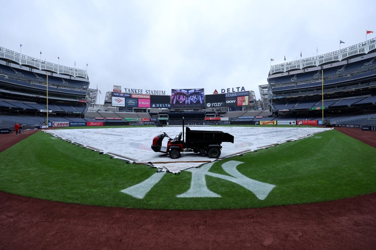 Aug 7, 2024; Bronx, New York, USA; General view of a tarp on the infield at Yankee Stadium before game one of a scheduled double header between the New York Yankees and Los Angeles Angels. Mandatory Credit: Brad Penner-USA TODAY Sports