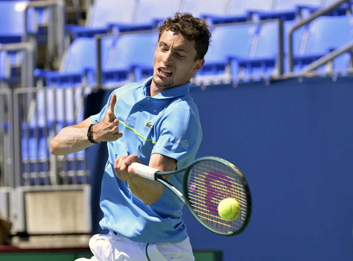 Aug 7, 2024; Montreal, Quebec, Canada; Ugo Humbert (FRA) hits a forehand against Arthur Fils (FRA) (not pictured) in first round play at IGA Stadium. Mandatory Credit: Eric Bolte-Imagn Images