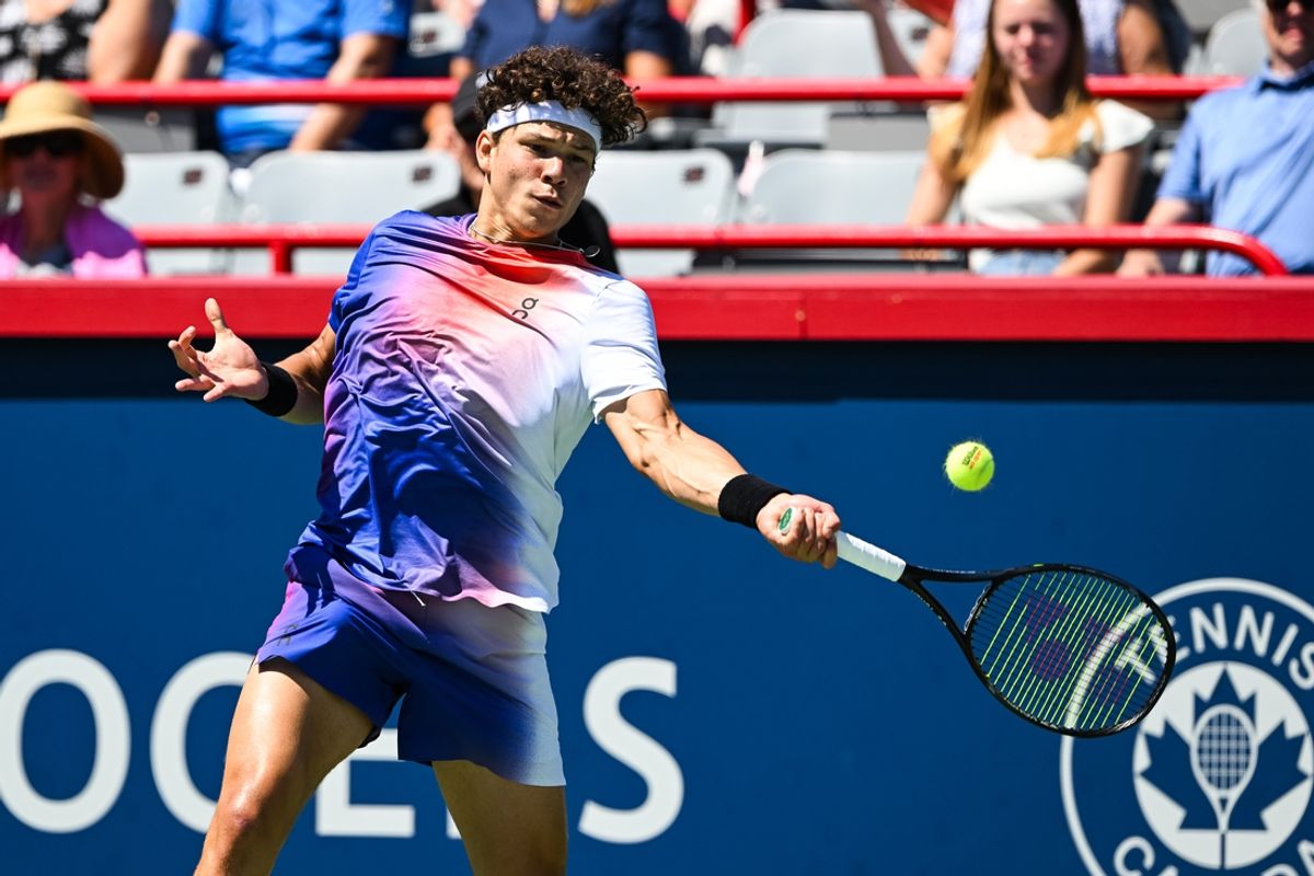 Aug 7, 2024; Montreal, Quebec, Canada; Ben Shelton (USA) returns the ball to Alexander Bublik (KAZ) (not pictured) in first round play at IGA Stadium. Mandatory Credit: David Kirouac-USA TODAY Sports