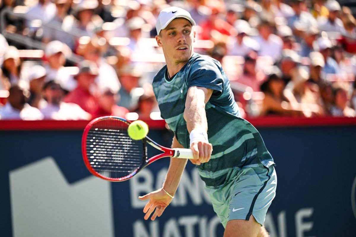 Aug 7, 2024; Montreal, Quebec, Canada; Denis Shapovalov (CAN) returns the ball to Brandon Nakashima (USA) (not pictured) in first round play at IGA Stadium. Mandatory Credit: David Kirouac-Imagn Images