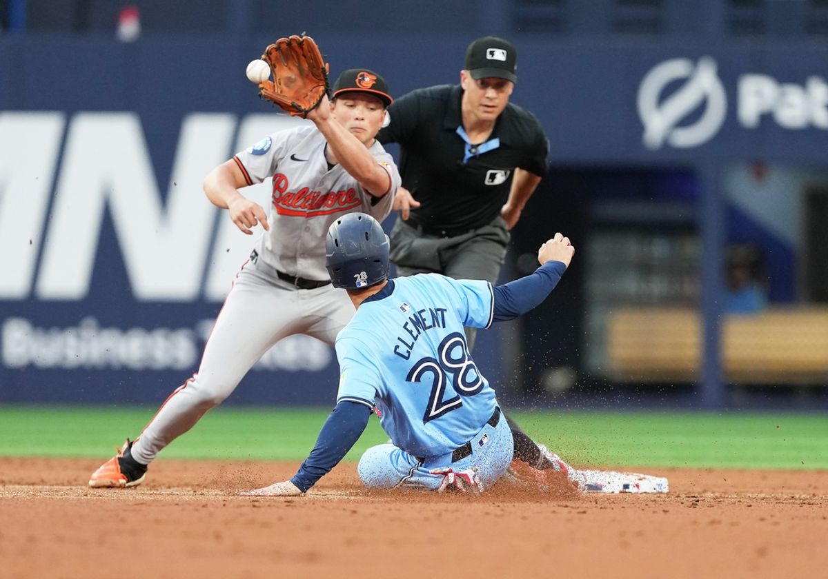 Aug 7, 2024; Toronto, Ontario, CAN; Toronto Blue Jays second baseman Ernie Clement (28) is tagged out at second base by Baltimore Orioles shortstop Gunnar Henderson (2) during the second inning at Rogers Centre. Mandatory Credit: Nick Turchiaro-USA TODAY Sports