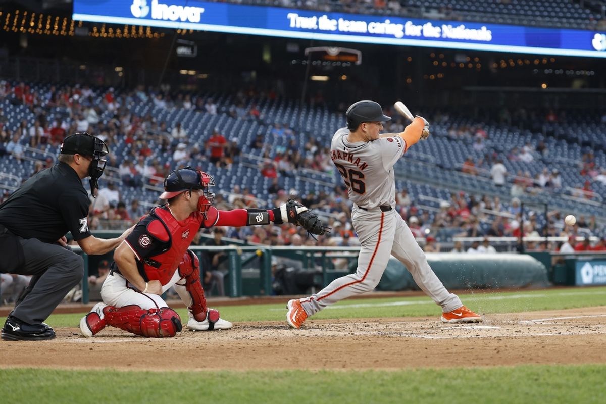 Aug 7, 2024; Washington, District of Columbia, USA; San Francisco Giants third baseman Matt Chapman (26) hits an RBI infield single against the Washington Nationals during the third inning at Nationals Park. Mandatory Credit: Geoff Burke-USA TODAY Sports