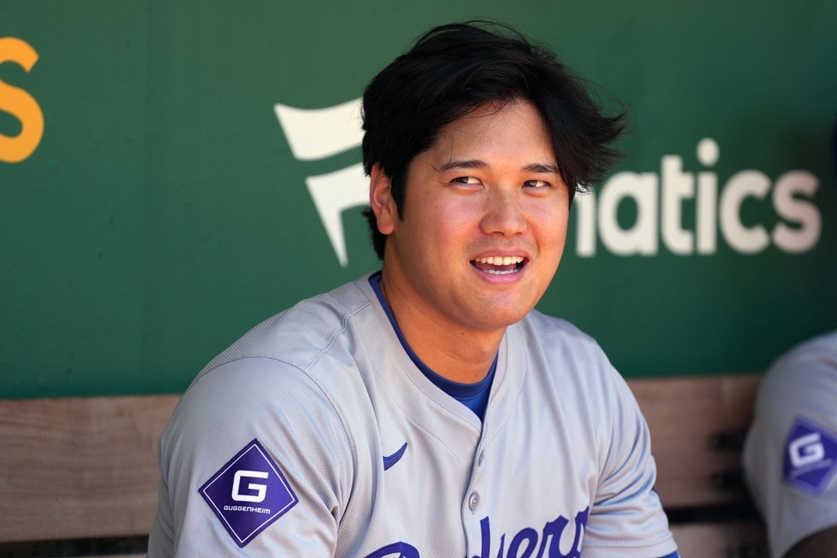 Aug 4, 2024; Oakland, California, USA; Los Angeles Dodgers designated hitter Shohei Ohtani (17) sits in the dugout before the game against the Oakland Athletics at Oakland-Alameda County Coliseum. Mandatory Credit: Darren Yamashita-Imagn Images