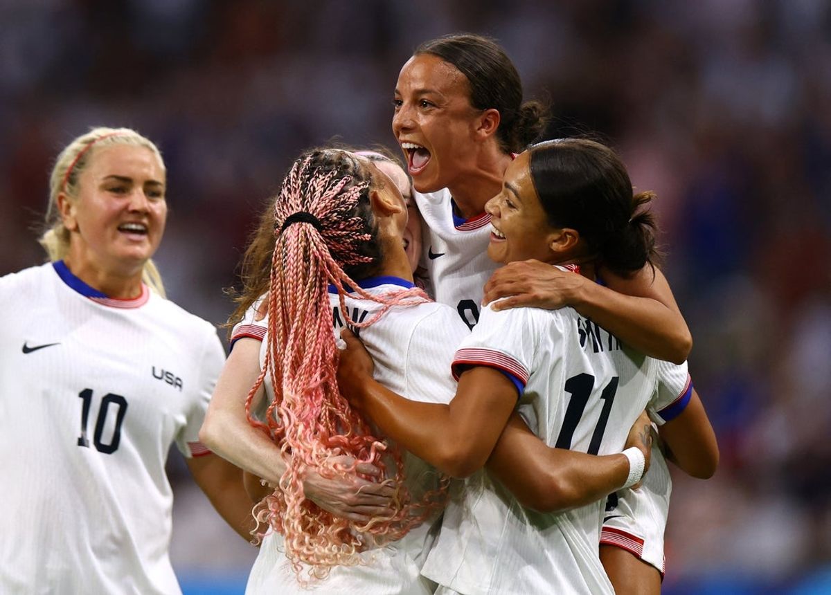 Jul 28, 2024; Marseille, France; USA players Sophia Smith , Mallory Swanson and Trinity Rodman celebrate a goal against Germany n a Group B match during the Paris 2024 Olympic Summer Games at Orange Velodrome. Mandatory Credit: Luisa Gonzalez/Reuters via Imagn Images
