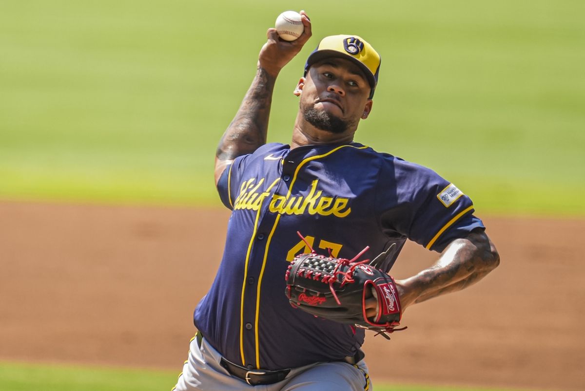 Aug 8, 2024; Cumberland, Georgia, USA; Milwaukee Brewers starting pitcher Frankie Montas (47) pitches against the Atlanta Braves during the first inning at Truist Park. Mandatory Credit: Dale Zanine-USA TODAY Sports