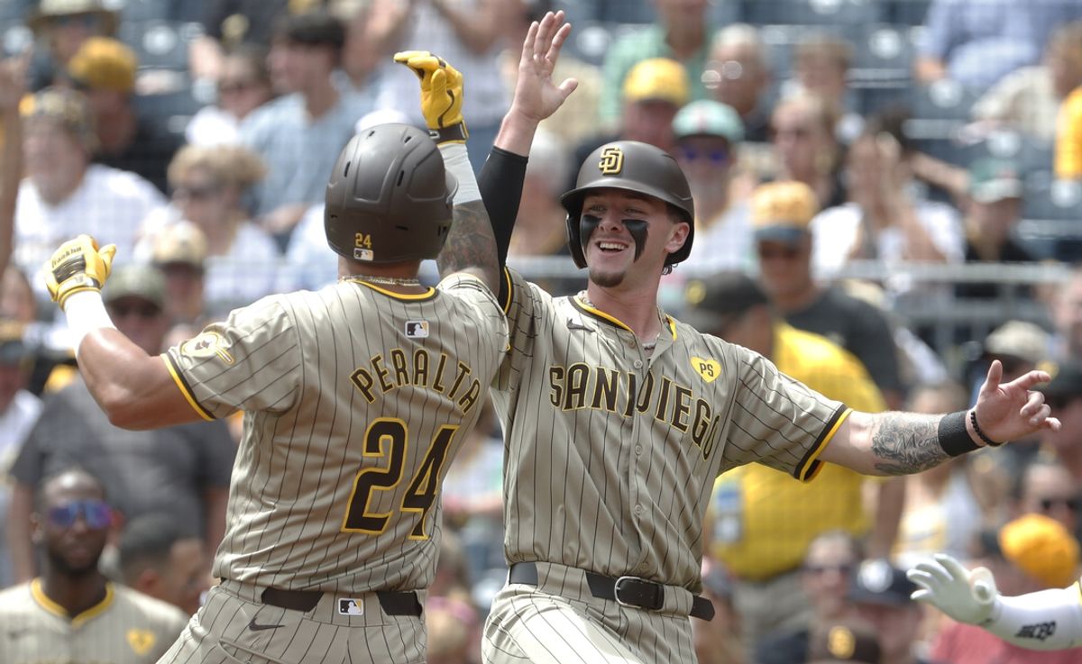 Aug 8, 2024; Pittsburgh, Pennsylvania, USA;  San Diego Padres right fielder David Peralta (24) celebrates with center fielder Jackson Merrill (right) after hitting a a two run home run against the Pittsburgh Pirates during the second inning at PNC Park. Mandatory Credit: Charles LeClaire-USA TODAY Sports