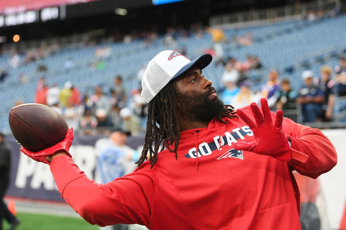 August 8, 2024; Foxborough, MA, USA;  New England Patriots linebacker Matthew Judon (9) plays catch with fans before a game against the Carolina Panthers at Gillette Stadium. Mandatory Credit: Eric Canha-USA TODAY Sports