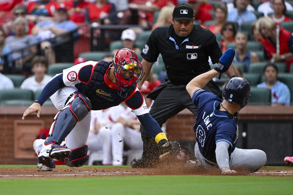 Aug 8, 2024; St. Louis, Missouri, USA;  Tampa Bay Rays second baseman Brandon Lowe (8) slides safely past St. Louis Cardinals catcher Willson Contreras (40) during the first inning at Busch Stadium. Mandatory Credit: Jeff Curry-USA TODAY Sports