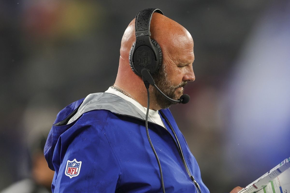 Aug 8, 2024; East Rutherford, New Jersey, USA;  New York Giants head coach Brian Daboll reviews the next play during the game against the Detroit Lions at MetLife Stadium. Mandatory Credit: Scott Rausenberger-USA TODAY Sports