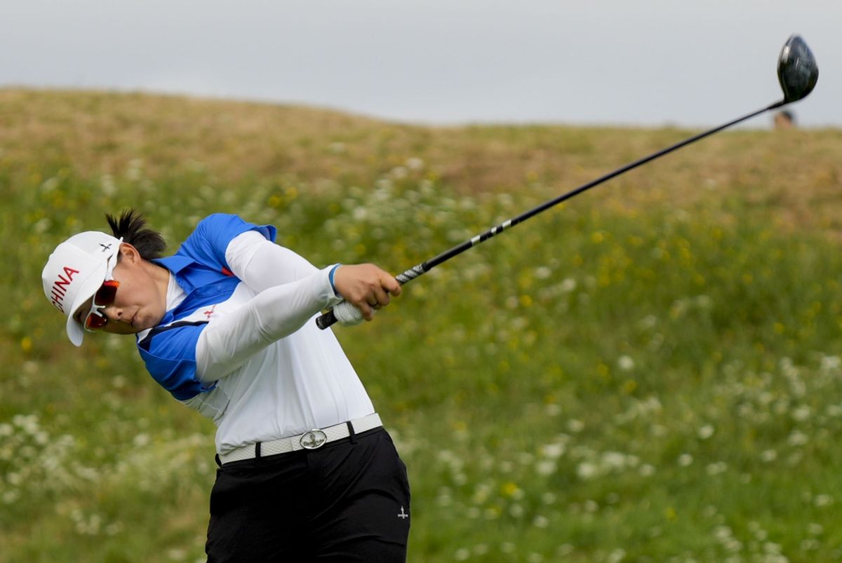 Aug 9, 2024; Saint-Quentin-en-Yvelines, France; Ruoning Yin (China) on no. 3 in the third round of women's individual stroke play during the Paris 2024 Olympic Summer Games at Le Golf National. Mandatory Credit: Katie Goodale-Imagn Images