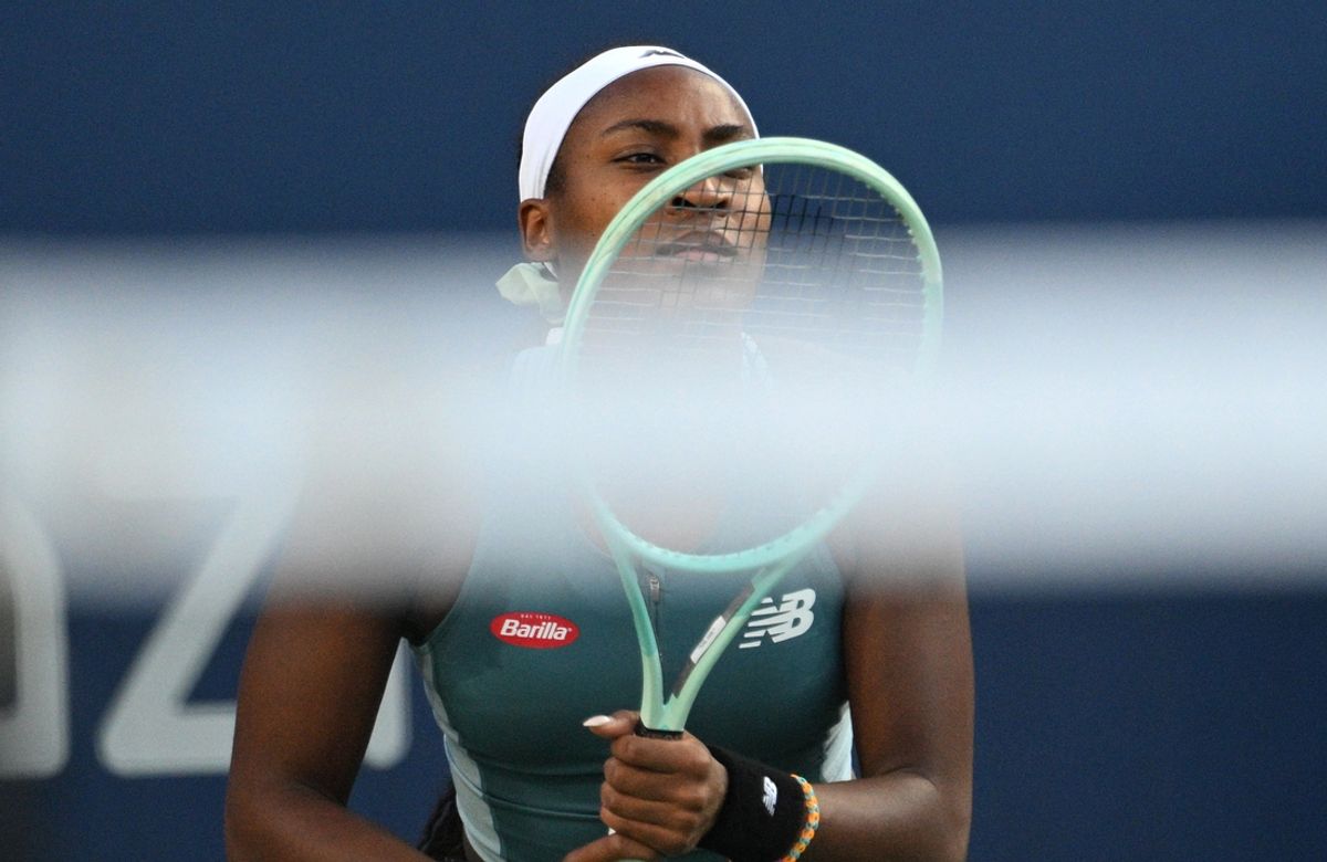 Aug 9, 2024; Toronto, Ontario, USA;  Coco Gauff (USA) looks over her racket and the net as she awaits a serve from Diana Shnaider (not shown)  in third round play at Sobeys Stadium. Mandatory Credit: Dan Hamilton-Imagn Images