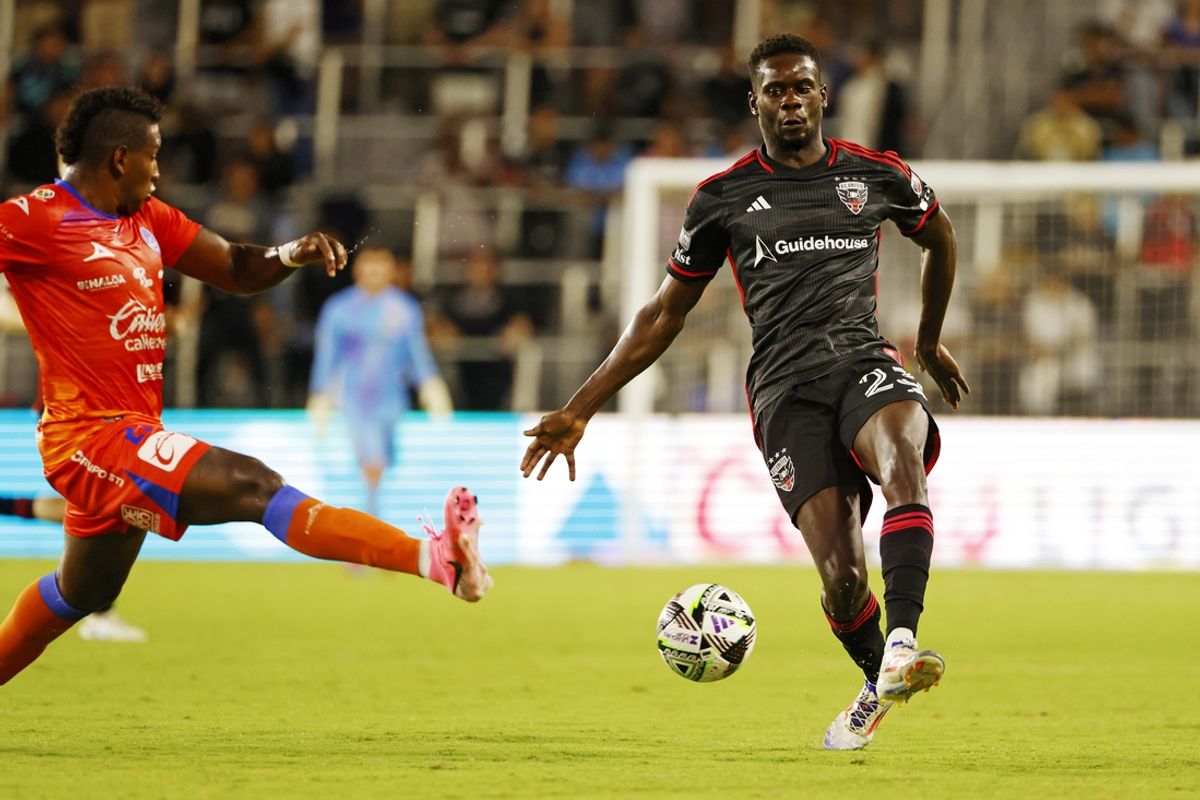 Aug 9, 2024; Washington, District of Columbia, USA; D.C. United forward Dominique Badji (23) kicks the ball against Mazatlan defender Willian Vargas (27) during the second half in the Leagues Cup Round of 32 at Audi Field. Mandatory Credit: Peter Casey-USA TODAY Sports