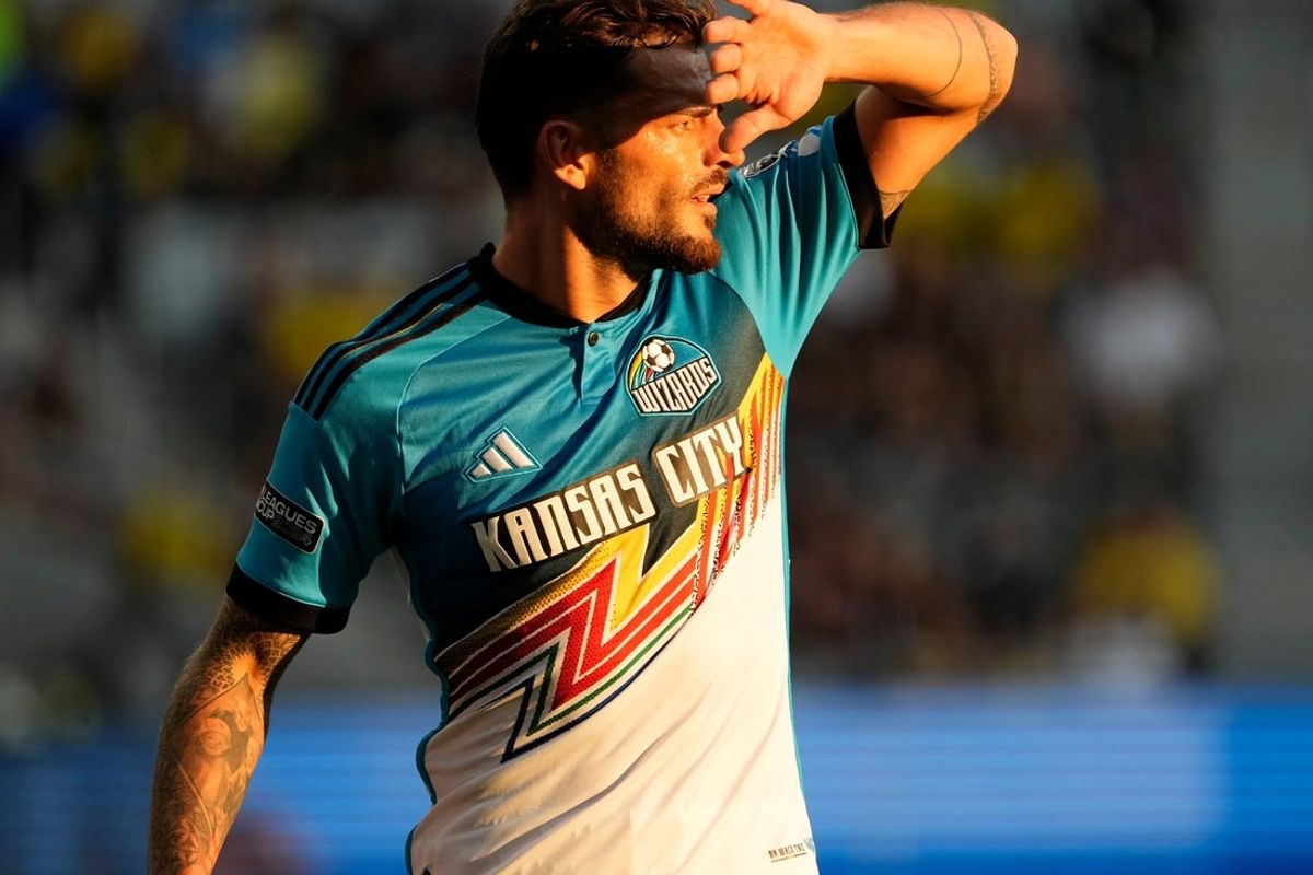 Aug 9, 2024; Columbus, OH, USA; Wearing a Wizards Archive Replica Jersey, Sporting Kansas City defender Tim Leibold (14) looks to pass during the first half of the Leagues Cup soccer match against the Columbus Crew at Lower.com Field. The Crew won 4-0.