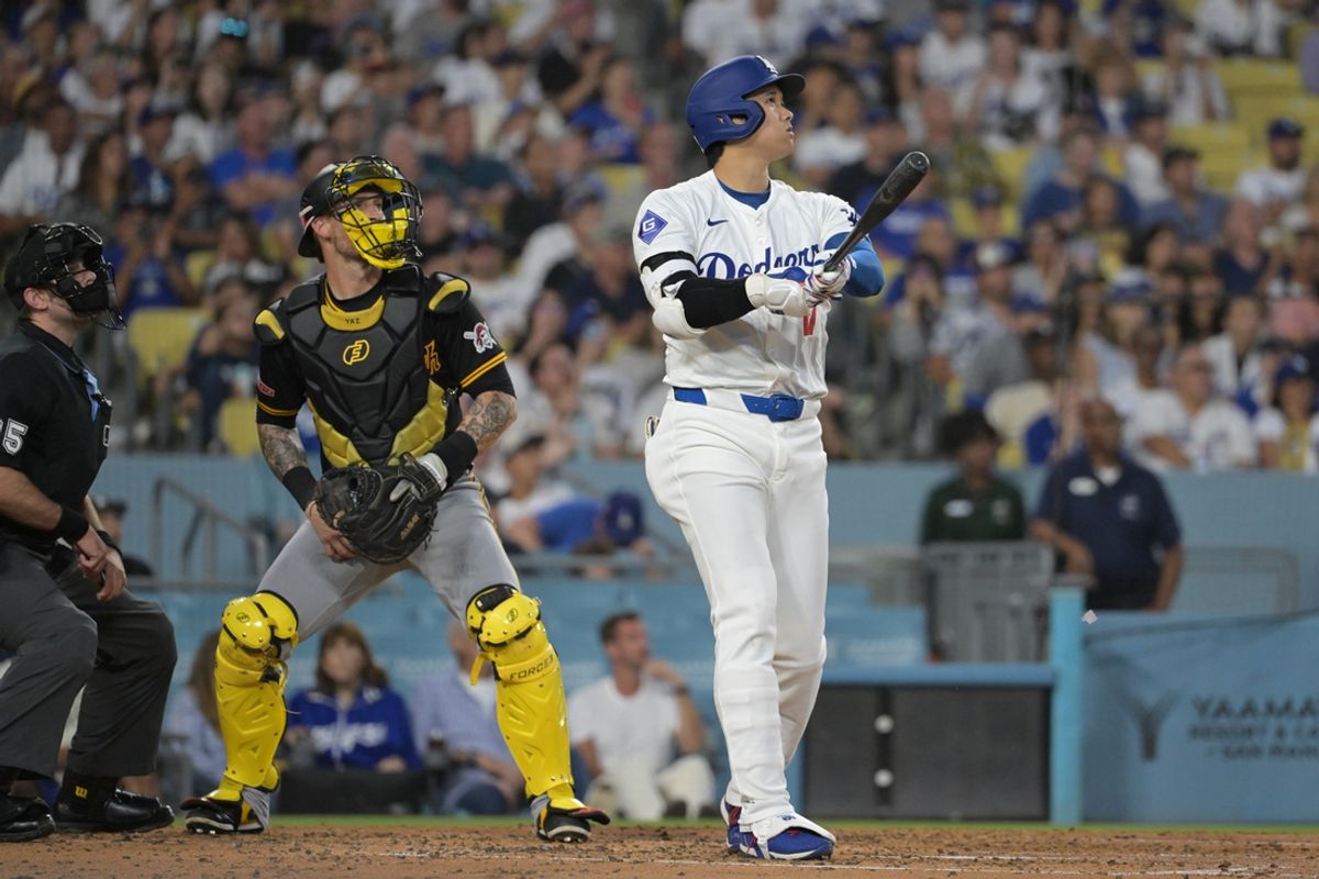 Aug 9, 2024; Los Angeles, California, USA; Pittsburgh Pirates catcher Yasmani Grandal (6) and Los Angeles Dodgers designated hitter Shohei Ohtani (17) watch the flight of the ball on a two-run home run in the third inning at Dodger Stadium. Mandatory Credit: Jayne Kamin-Oncea-USA TODAY Sports