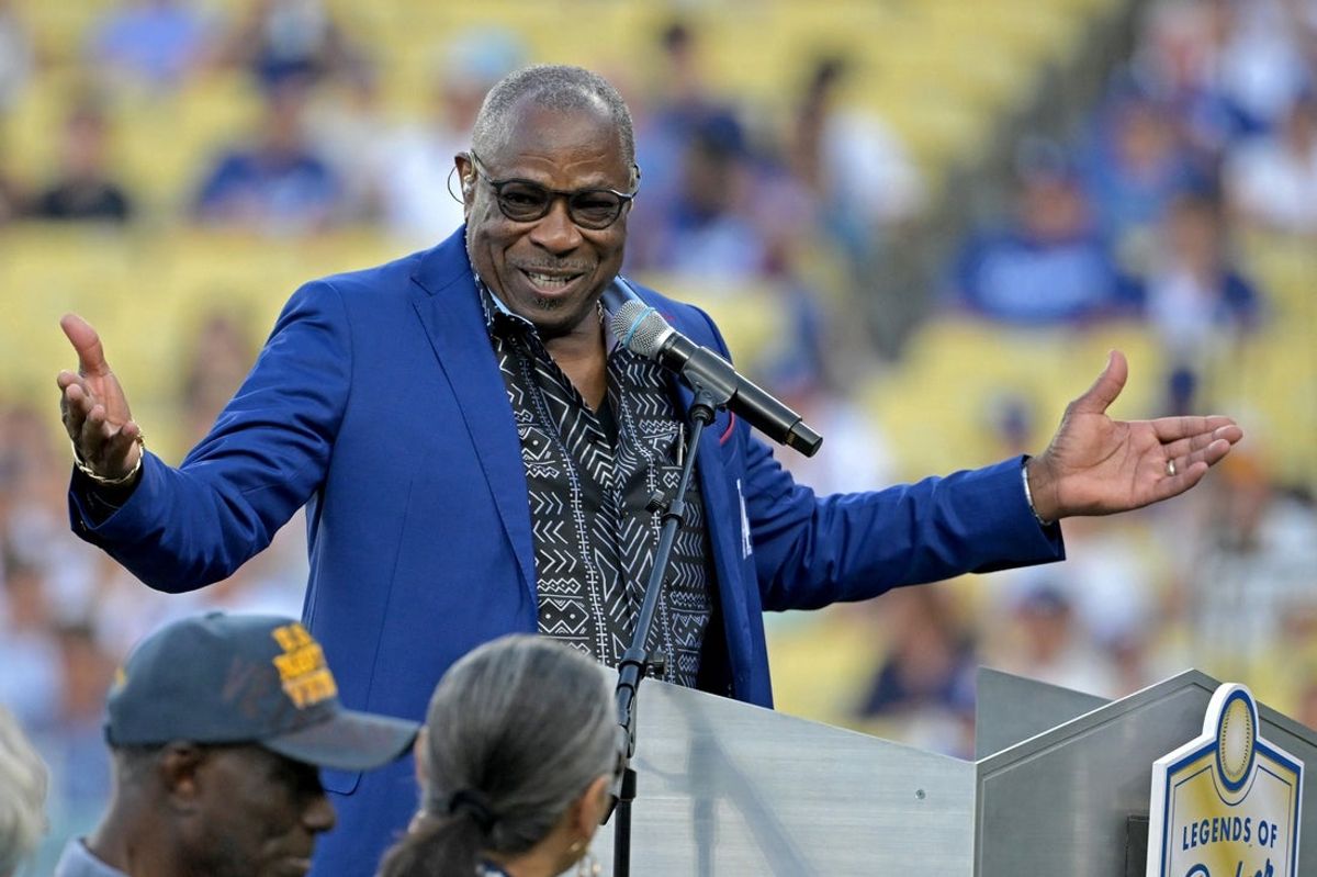 Aug 9, 2024; Los Angeles, California, USA;  Former Los Angeles Dodgers outfielder Dusty Baker speaks to fans after being inducted into the Dodgers Hall of Legends prior to the game between the Los Angeles Dodgers and the Pittsburgh Pirates at Dodger Stadium. Mandatory Credit: Jayne Kamin-Oncea-Imagn Images