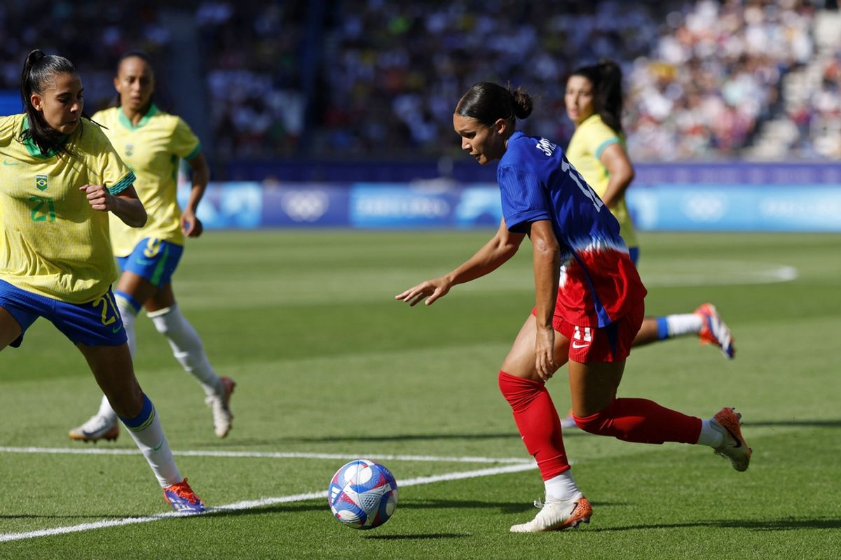 Aug 10, 2024; Paris, France; United States forward Sophia Smith (11) dribbles the ball against Brazil during the first half in the women's soccer gold medal match during the Paris 2024 Olympic Summer Games at Parc des Princes. Mandatory Credit: Yukihito Taguchi-Imagn Images